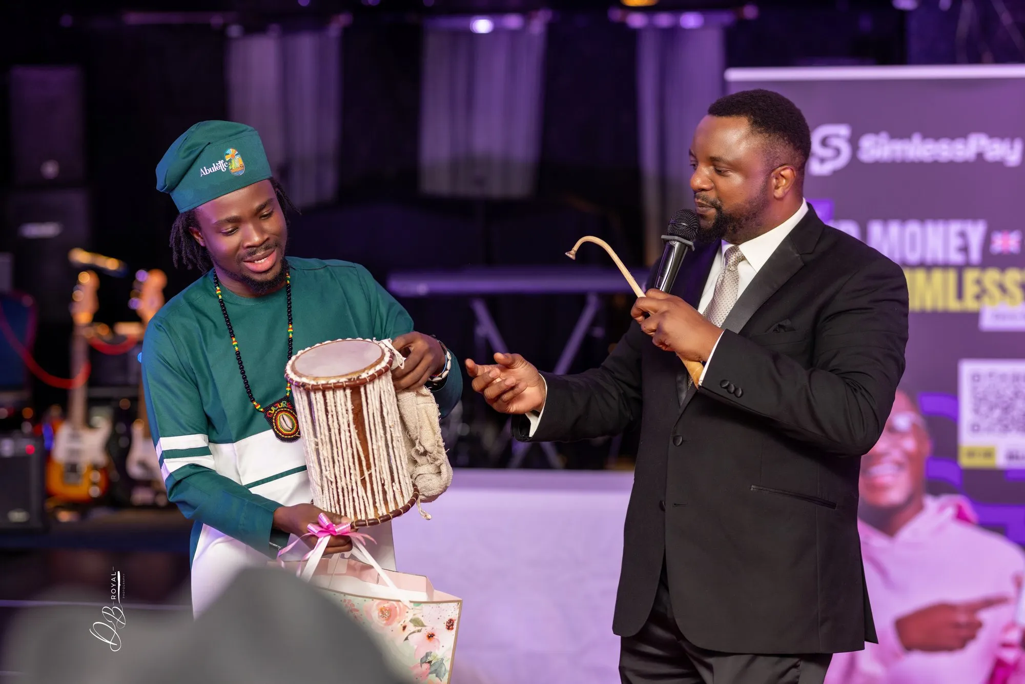 A talking drum is presented on stage
